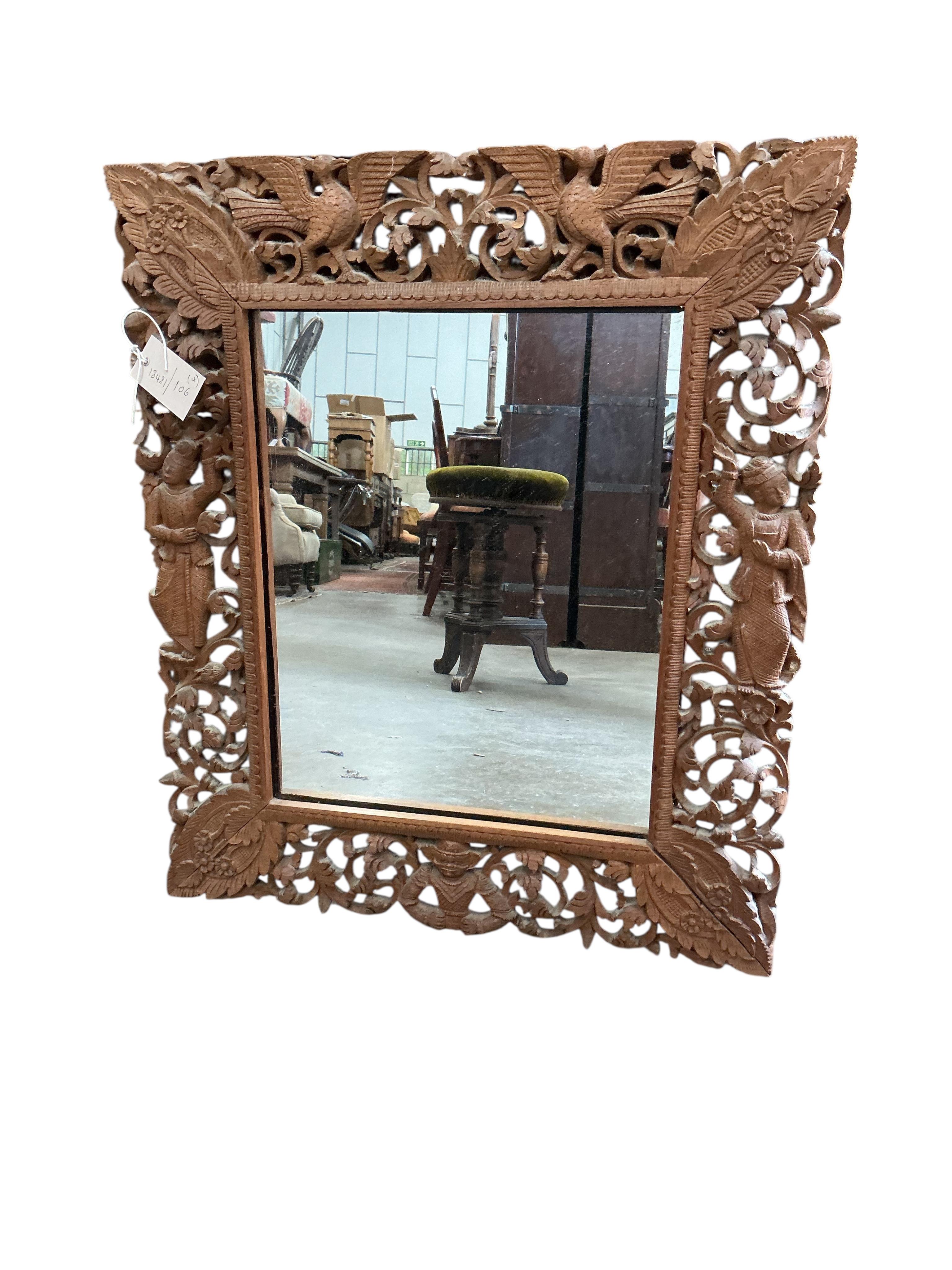 A late Victorian carved oak square two tier table, 59cm, height 66cm, together with a Victorian piano stool, a wall bracket and a Balinese wall mirror